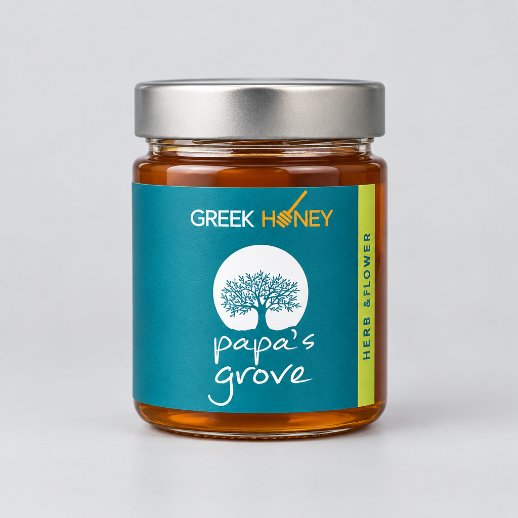 A closeup of a glass jar of Greek Herb & Flowrr Honey from Papa's Grove, filled with golden honey and featuring a teal label with a tree logo, set against a neutral light gray background.