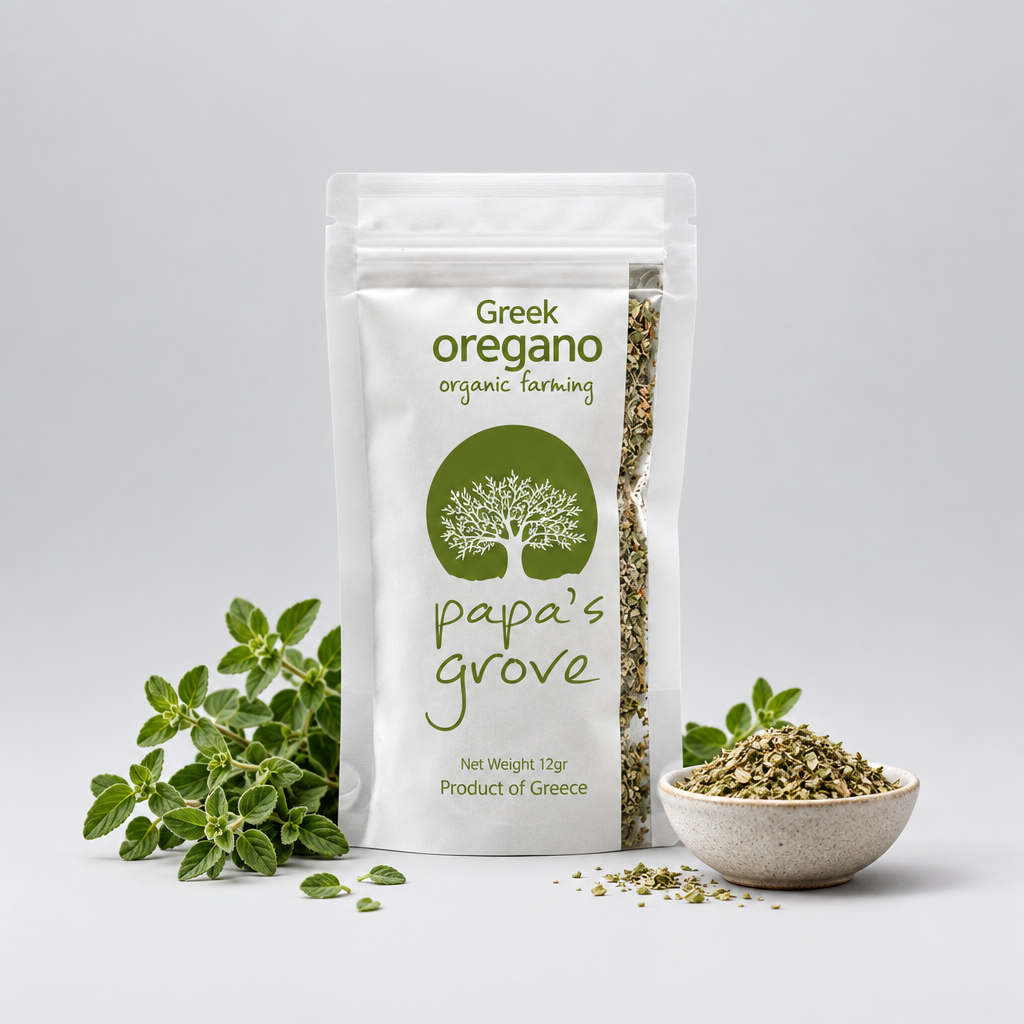 A stand-up pouch of Greek oregano organic farming by papa's grove, shown on a light gray background with fresh oregano sprigs and a small bowl of dried oregano flakes