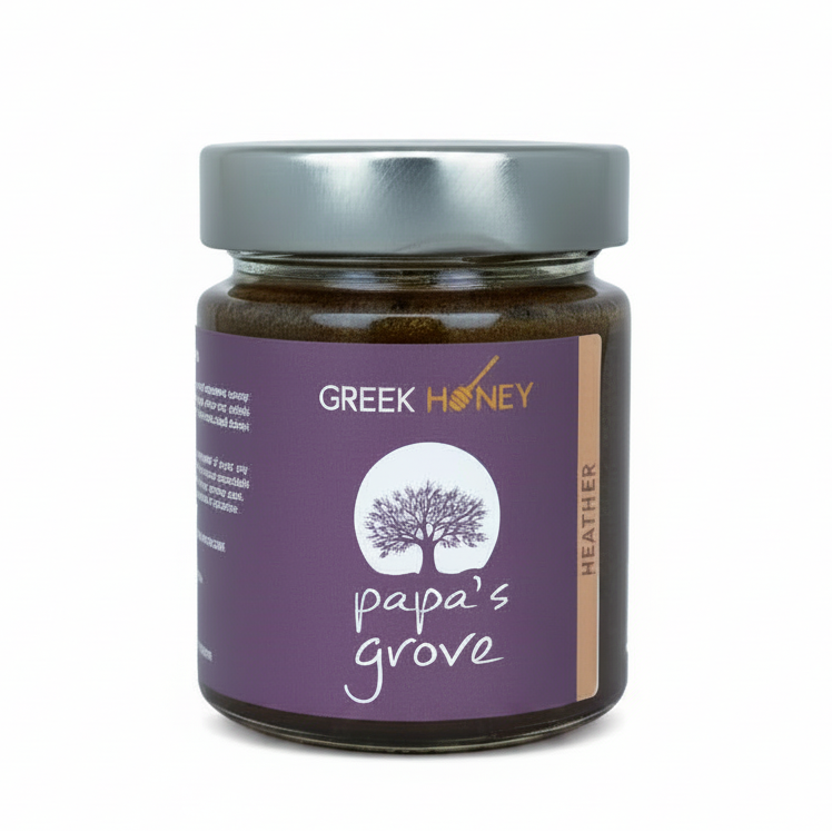 A jar of Greek Honey from Papa's Grove, Heather flavor, with a purple label and a silver lid, set against a plain white background.