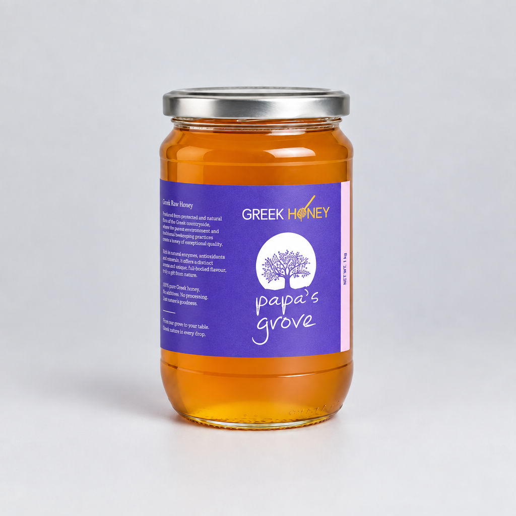 A glass jar of Greek Honey from Pape's Grove, filled with golden honey and featuring a purple label with white text and a tree logo, sealed with a silver metal lid on a light gray background.