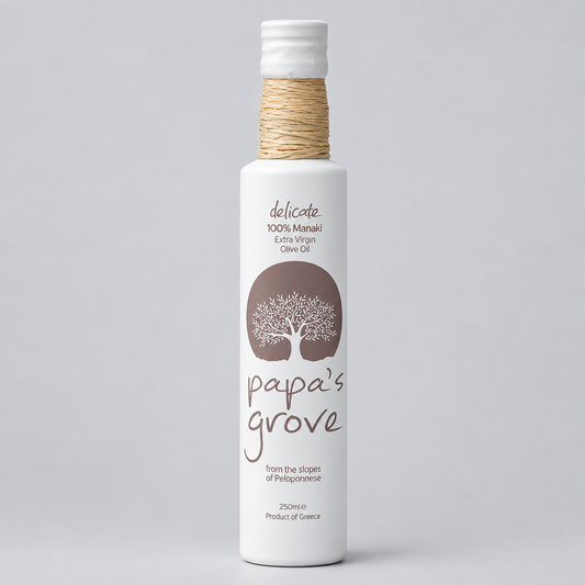 Bottle of Delicate 100% Manaki Papa's Grove olive oil on a light grey background